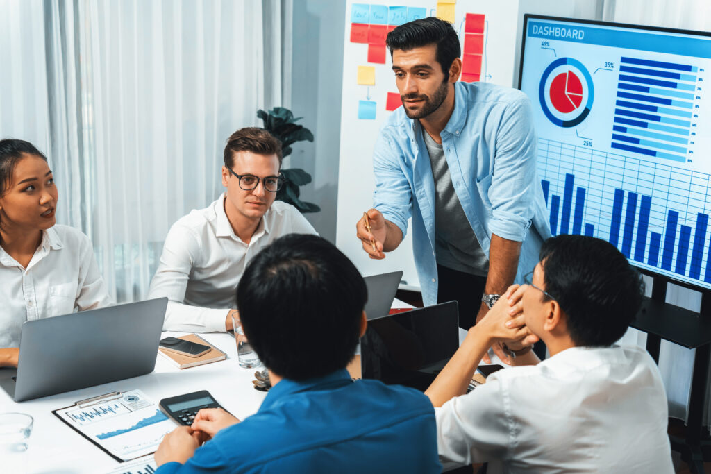 analyst team utilizing bi fintech to analyze financial data at table. prudent analyst team utilizing bi fintech to analyze financial data at table. prudent